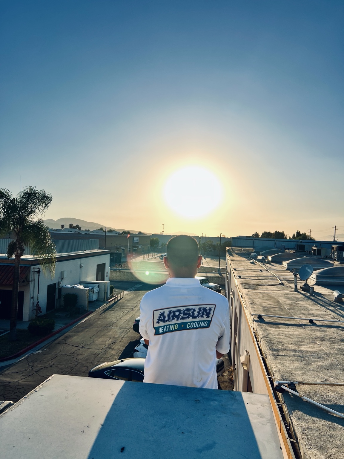 Airsun team member wearing an Airsun shirt on a job